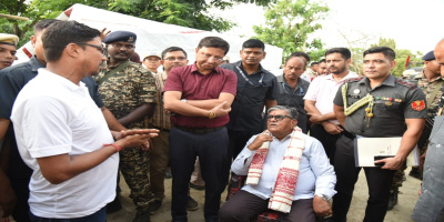 Governor interacting with a person during his visit to flood-hit Morigaon district.