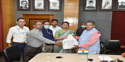 During the distribution of food basket to NHM officials for TB patients in Raj Bhavan