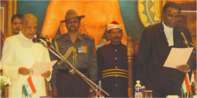 Governor Janaki Ballav Patnaik taking the Oath of Office