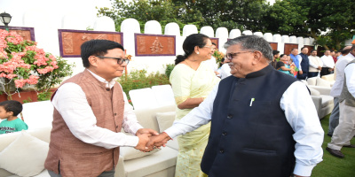 The Governor greeting the leader of opposition during At Home function.